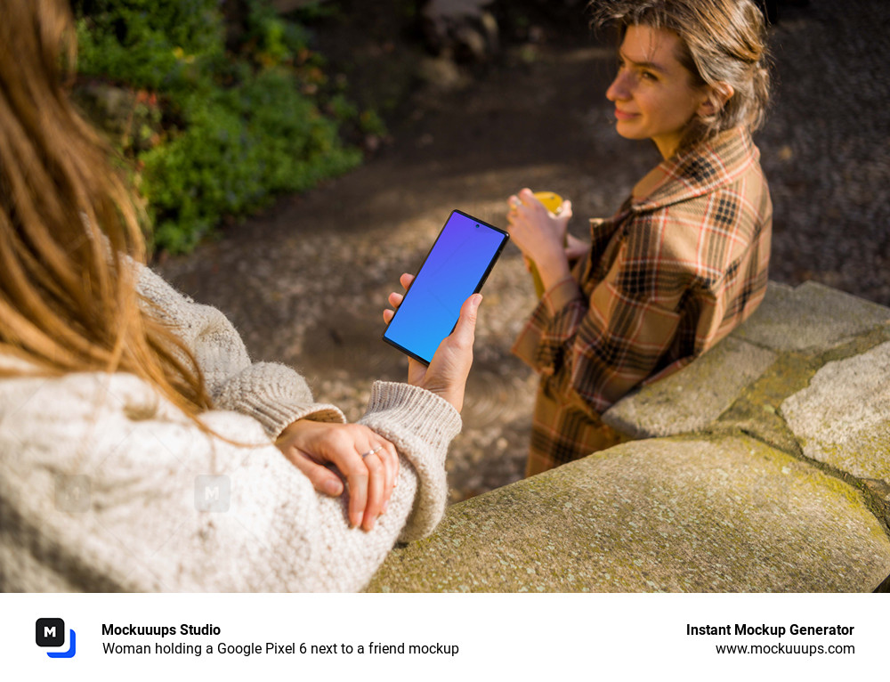Woman holding a Google Pixel 6 next to a friend mockup