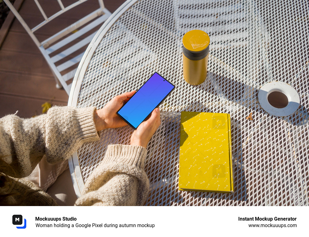 Woman holding a Google Pixel during autumn mockup