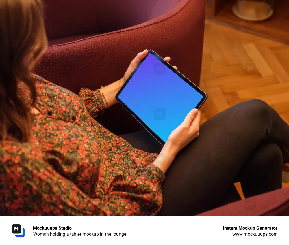 Woman holding a tablet mockup in the lounge