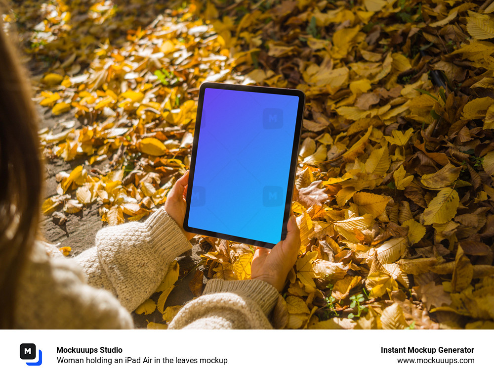 Woman holding an iPad Air in the leaves mockup