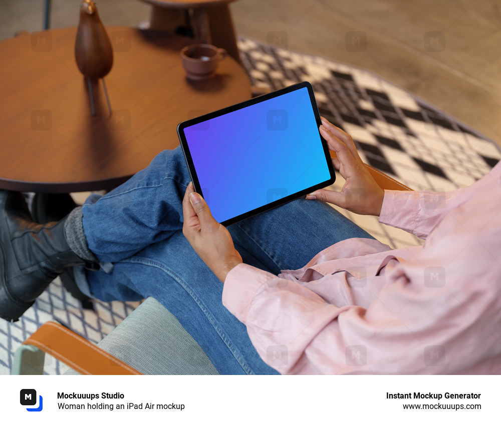 Woman holding an iPad Air mockup