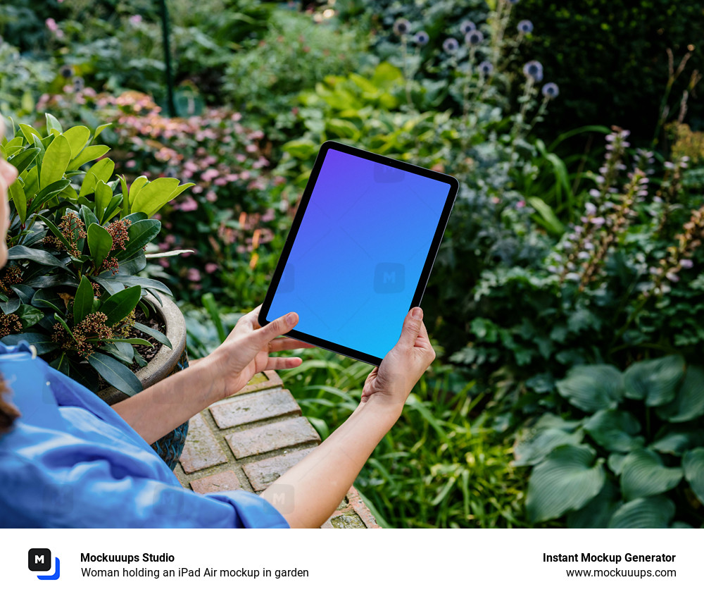 Woman holding an iPad Air mockup in garden 
