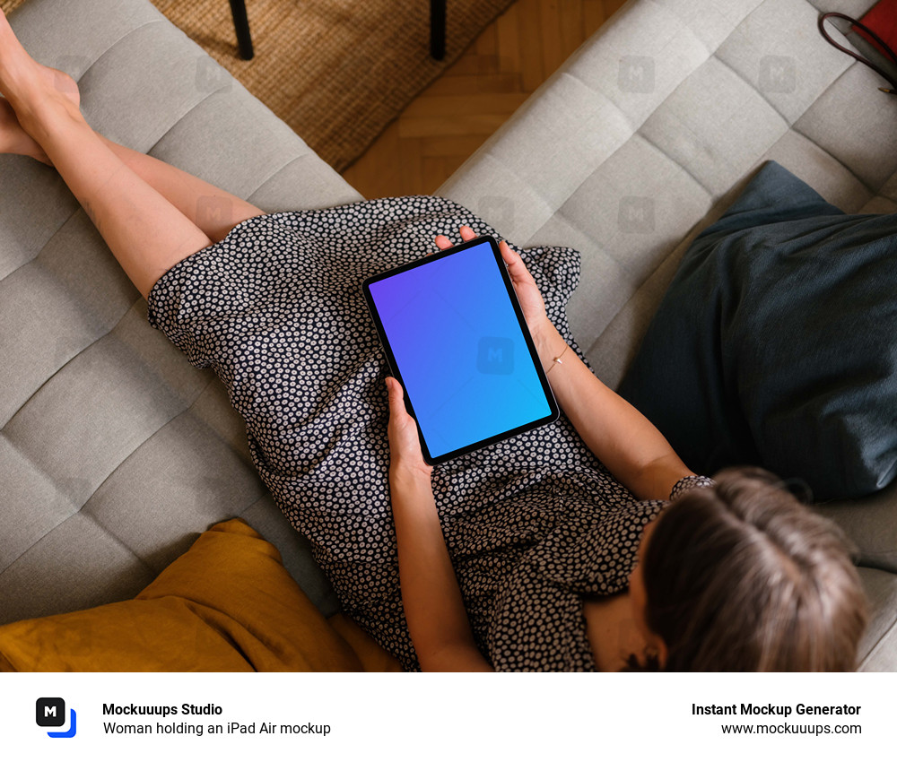 Woman holding an iPad Air mockup