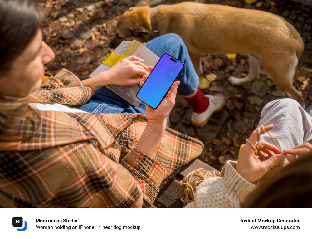 Woman holding an iPhone 14 near dog mockup