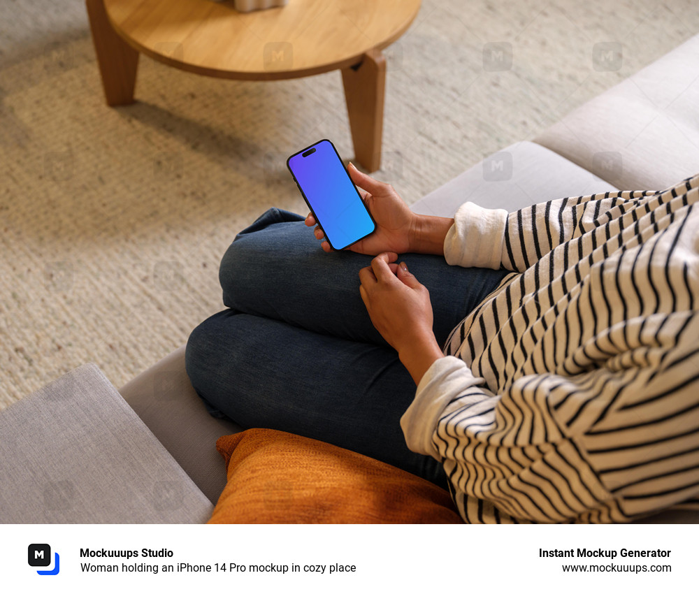 Woman holding an iPhone 14 Pro mockup in cozy place