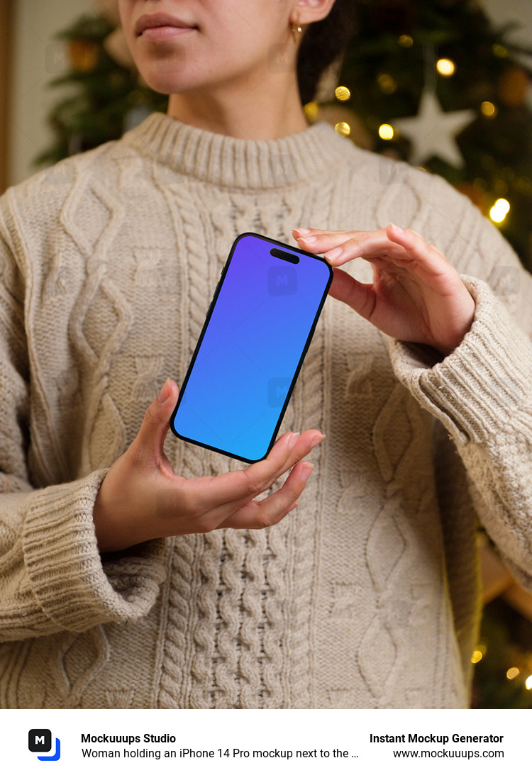 Woman holding an iPhone 14 Pro mockup next to the Christmas tree