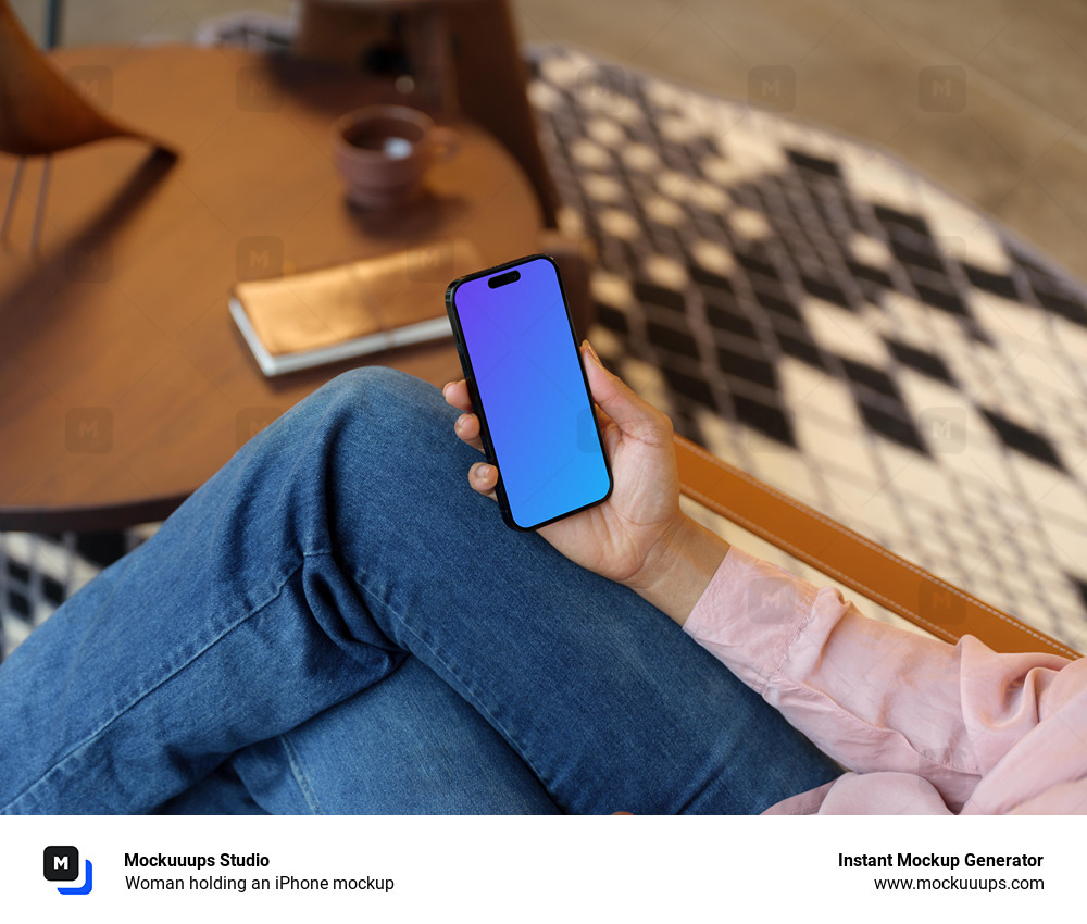 Woman holding an iPhone mockup