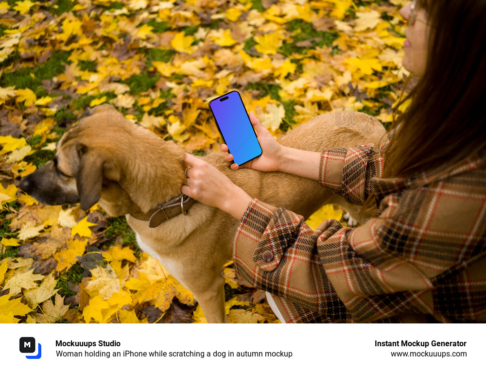 Woman holding an iPhone while scratching a dog in autumn mockup