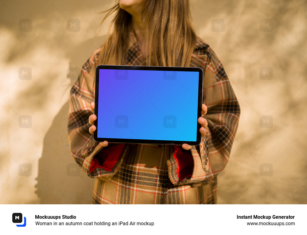 Woman in an autumn coat holding an iPad Air mockup