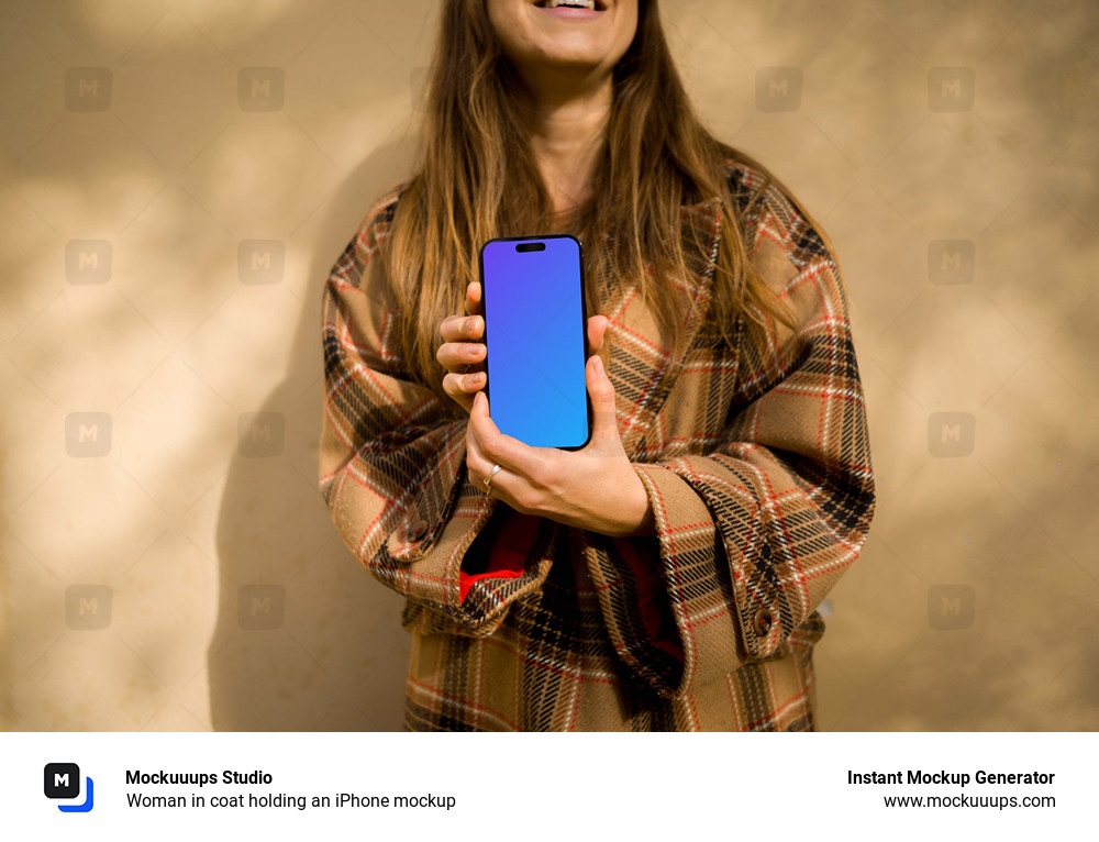 Woman in coat holding an iPhone mockup