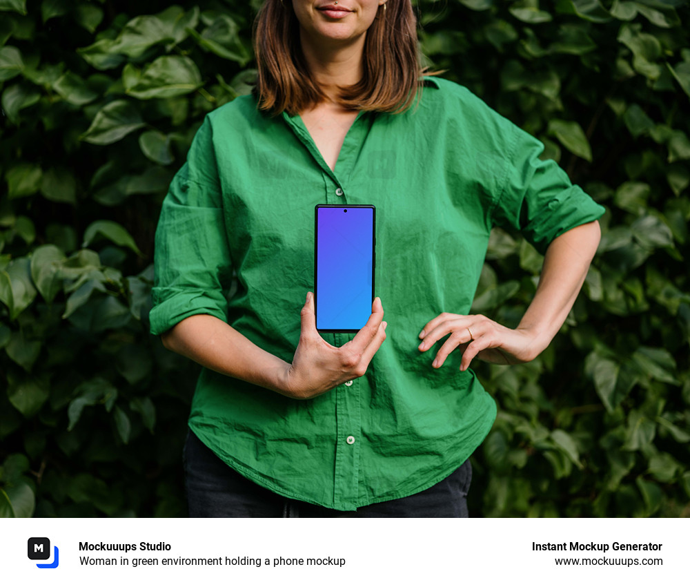 Woman in green environment holding a phone mockup 