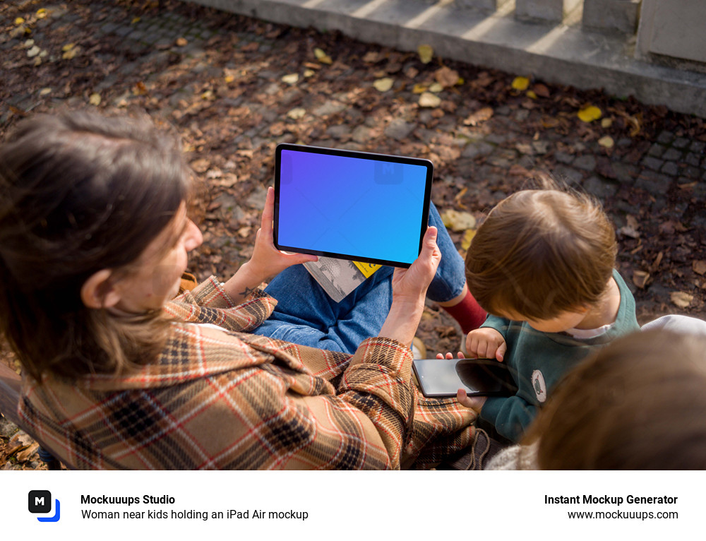 Woman near kids holding an iPad Air mockup