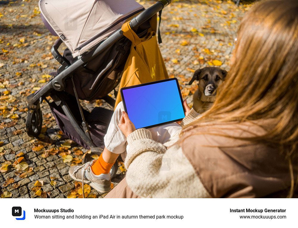 Woman sitting and holding an iPad Air in autumn themed park mockup