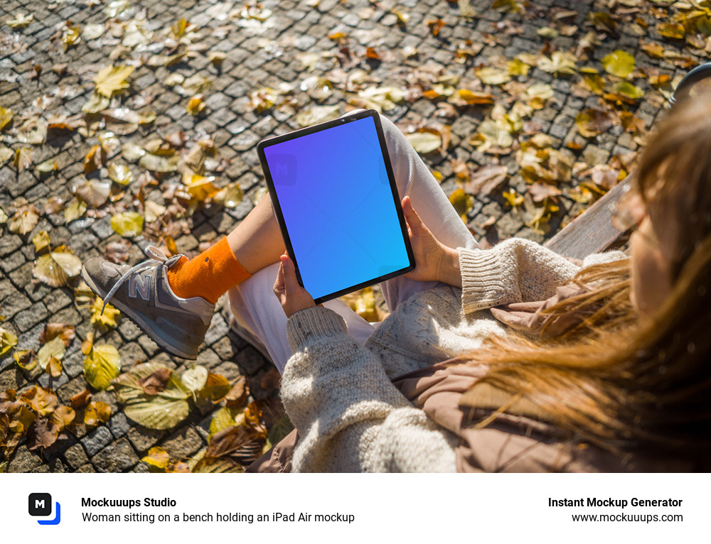 Woman sitting on a bench holding an iPad Air mockup