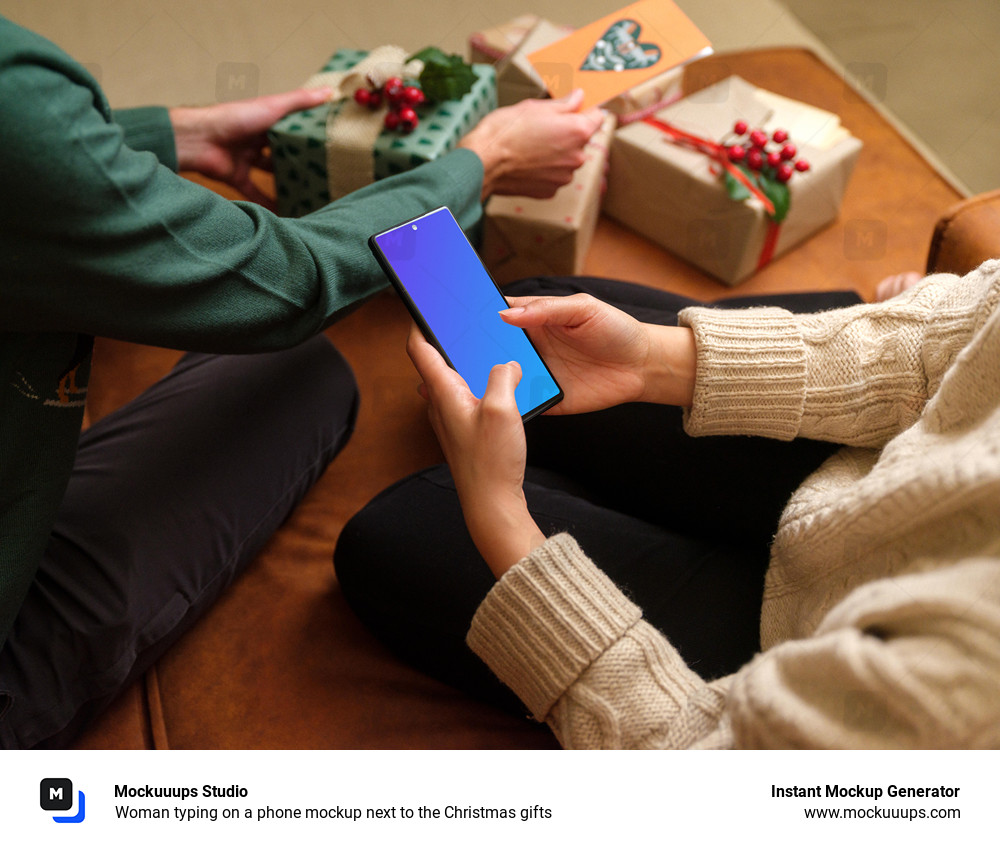 Woman typing on a phone mockup next to the Christmas gifts