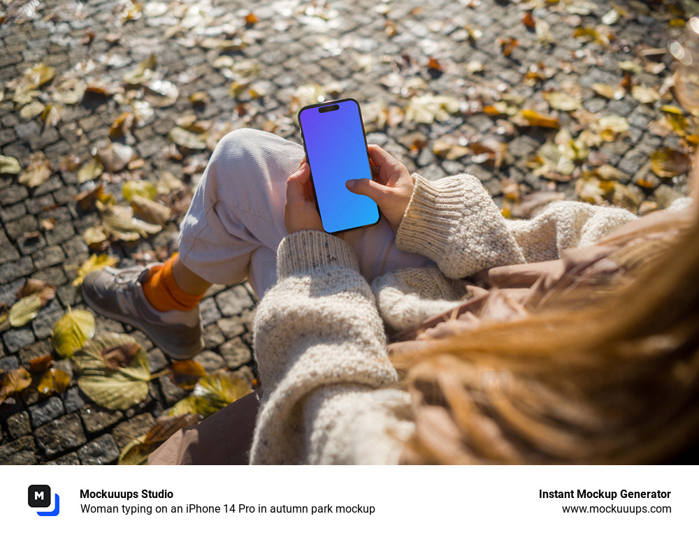 Woman typing on an iPhone 14 Pro in autumn park mockup