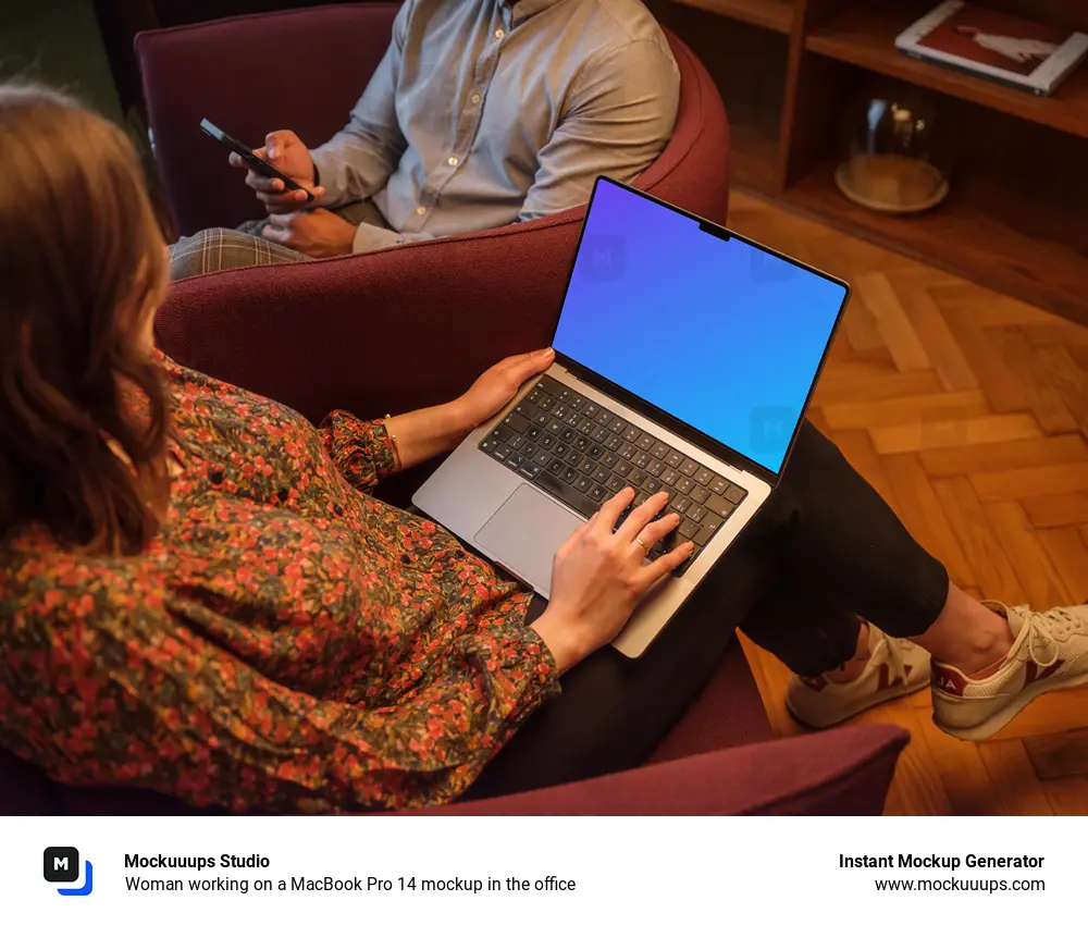 Woman working on a MacBook Pro 14 mockup in the office