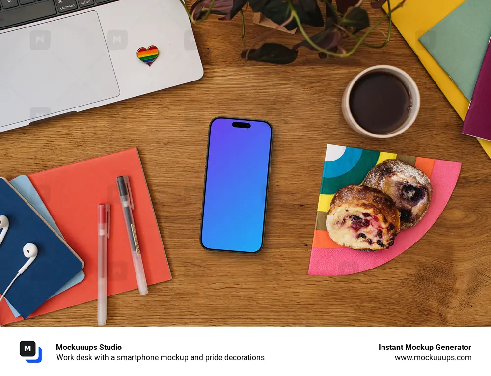 Work desk with a smartphone mockup and pride decorations