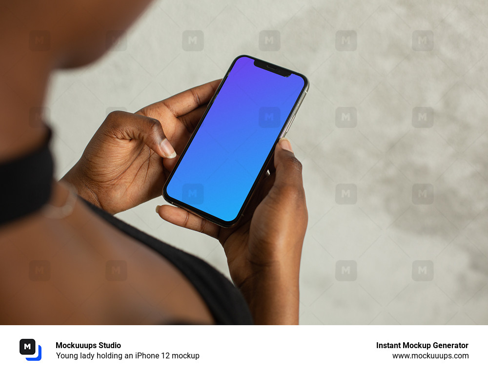 Young lady holding an iPhone 12 mockup