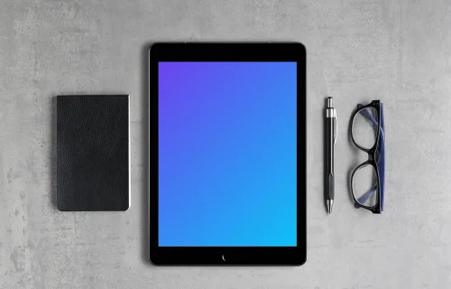 iPad Pro mockup with a journal on the side
