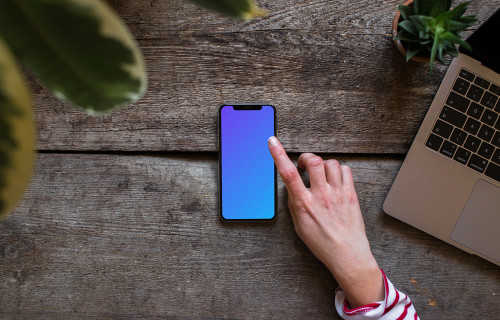 Download Woman holding Clay iPhone XS mockup (Perspective - Transparent) - Mockuuups Studio