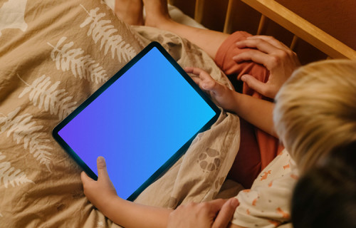 Boy's hands holding an iPad Air mockup