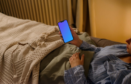 Female hand holding an iPhone mockup