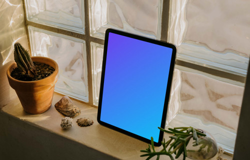 iPad Air mockup placed against a glass window