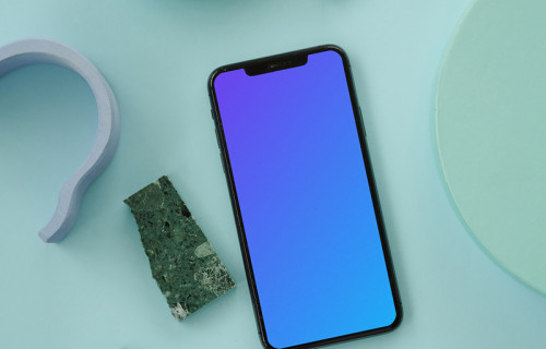 iPhone mockup on a blue table