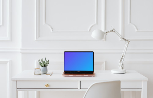 MacBook Air mockup on a white background with a reading lamp at the side