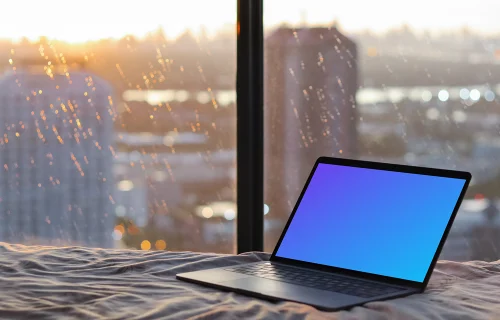 MacBook Pro mockup on bed