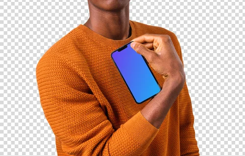 Man in orange sweater holding iPhone mockup in one hand
