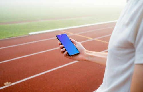 Runner holding a Google Pixel 6 mockup