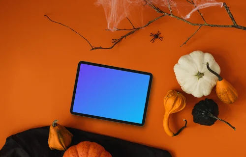 Top view of landscape tablet mockup with halloween decorations