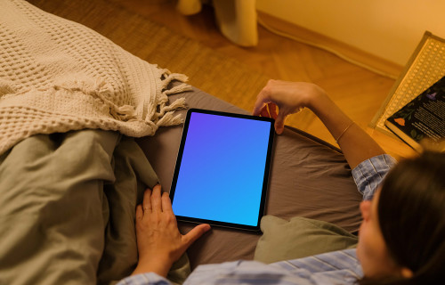 User holding an iPad Air mockup