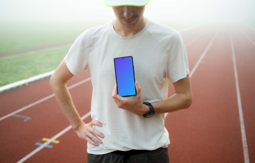 Athlete holding a smartphone mockup