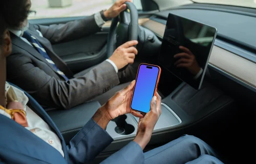 Businesspeople in Tesla with iPhone mockup