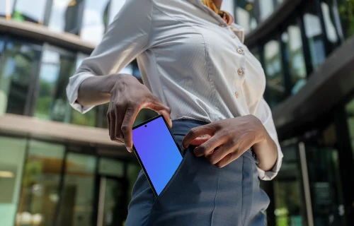 Businesswoman putting Google Pixel into her pocket