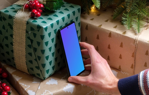 Navidad mockup con Google Pixel bajo el árbol de Navidad