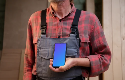 Crafter in overalls holding a Google Pixel 6 mockup