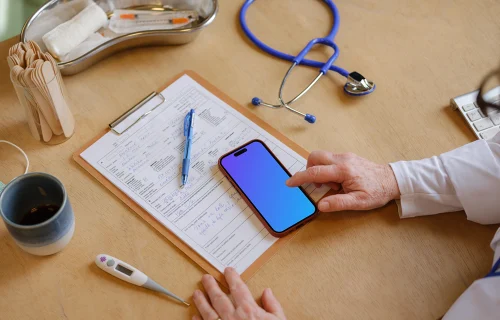 Doctor typing on the iPhone 14 Pro mockup