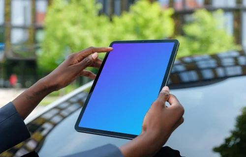 Female entrepreneur holding an iPad Air mockup