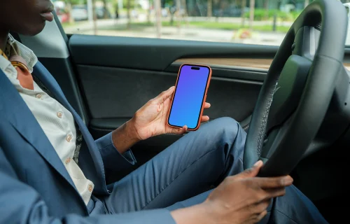 Female entrepreneur in Tesla with iPhone 14 Pro mockup