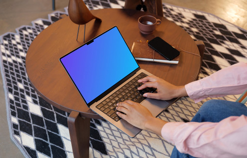 Female typing on a MacBook Pro 14 mockup