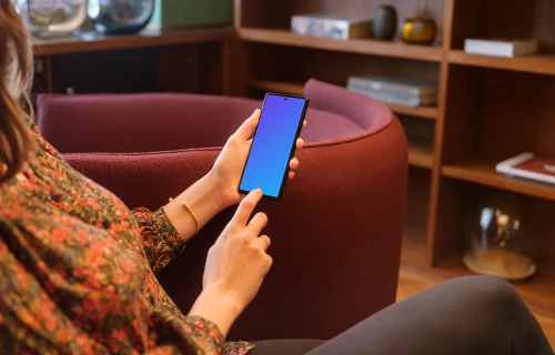Female working on a Google Pixel mockup in a lounge area