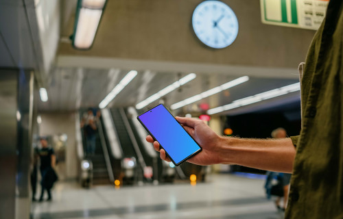 Holding a Google Pixel 6 mockup at the subway station