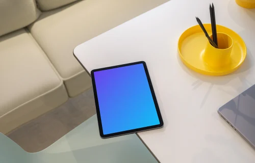 iPad Air mockup on modern glass table with creative accessories