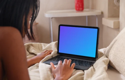 iPad Air mockup with a woman working in bed
