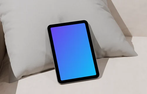 iPad mini mockup on a modern sofa cushion