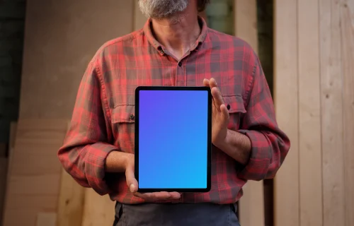 iPad mockup held by a repairman